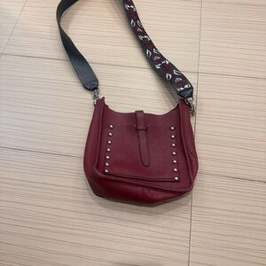 Rebecca Minkoff Studded Burgo Leather Crossbody Bag with Guitar Strap.